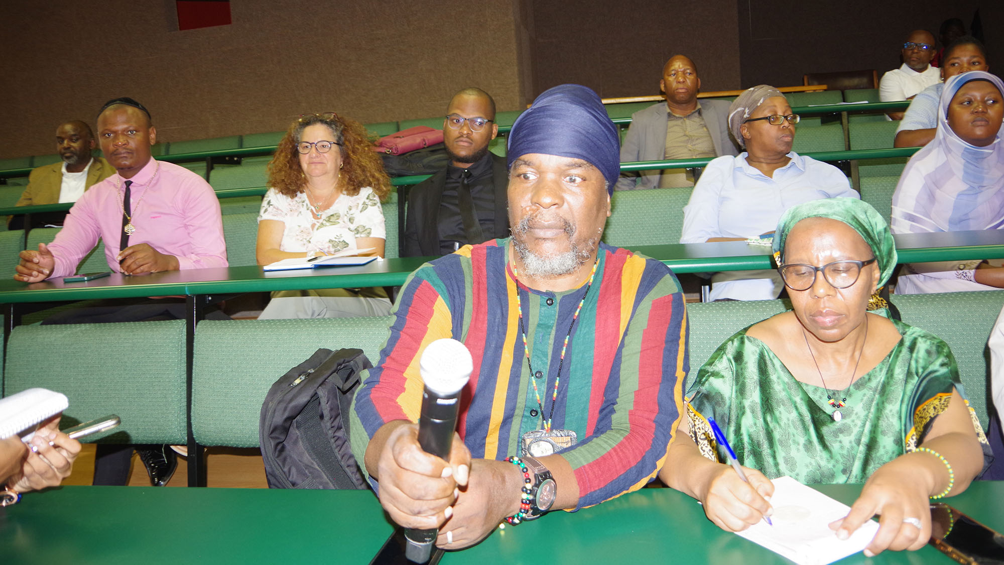 Ambrose Zwane and his wife Nompumelelo from the Rastafarian Community with other members of faith groups at the meeting.